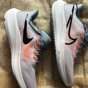 Nike Running Shoes with Black Swoosh and Orange Accents
